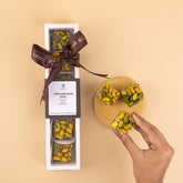 Packaged dessert with a brown ribbon on a beige background