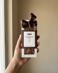 Almond Pistachio Bites box of 3 held in one hand